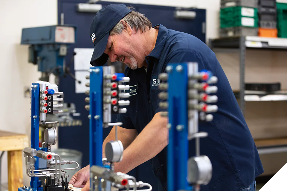 SLS-Shawn-CustomBox-web Sloan Lubrication Systems employee working on some custom lubricator boxes